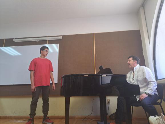 Luis Chapa working with a singer